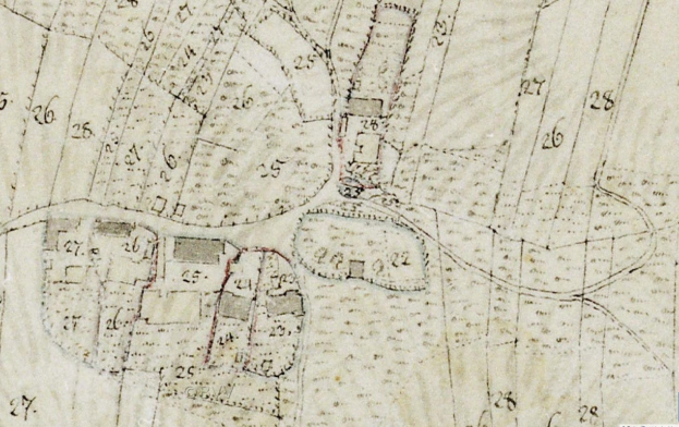 Detailierter alter Stadtplan mit nummerierten Gebäuden, Straßen und Text, der eine geplante Entwicklungsstelle am unteren Rand zeigt.