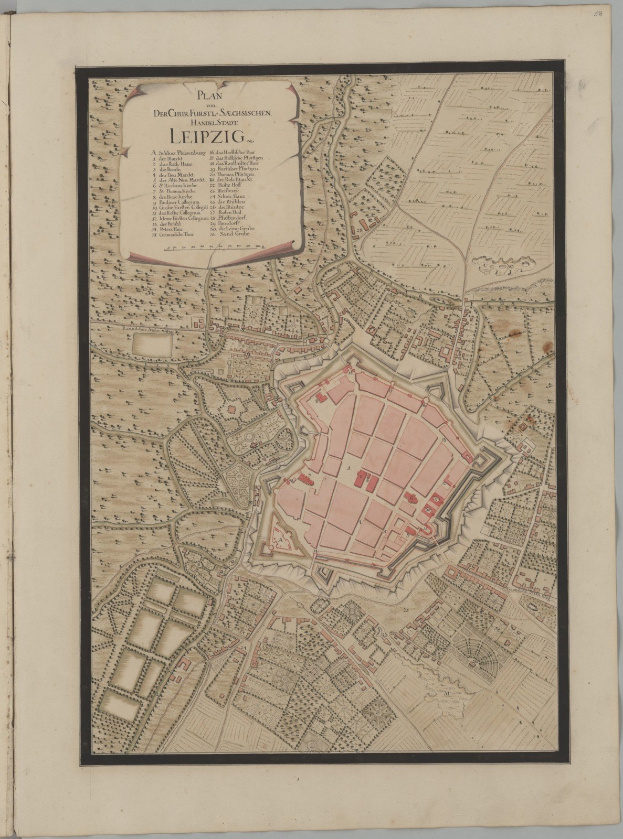 Ein altes Buch mit einer detaillierten Karte von Leipzig, Deutschland, das Straßen, Gebäude und Sehenswürdigkeiten zeigt.