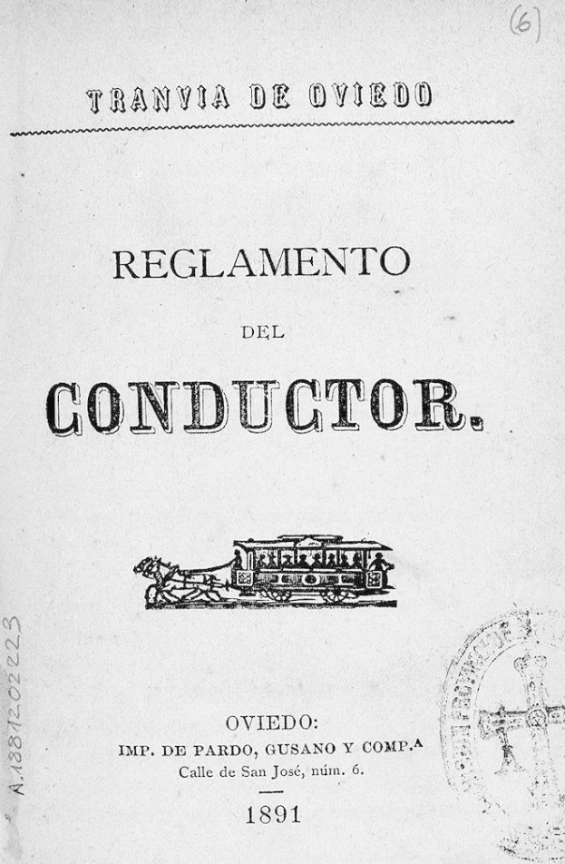 Altes Buch mit dem Titel "Reglamento de Conductor" und einer Zugillustration auf dem Cover sowie einem Stempel auf der rechten Seite.
