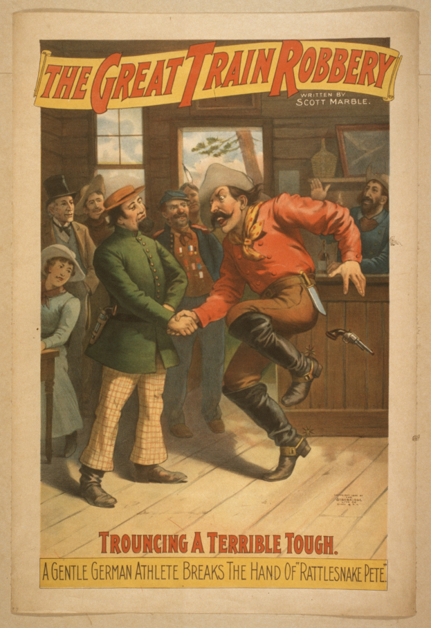 Eine Gruppe von Menschen, die drinnen stehen, einer hält eine Waffe, mit Text oben und unten: "Der große Zugraub - Trouching ein schreckliches Tough".